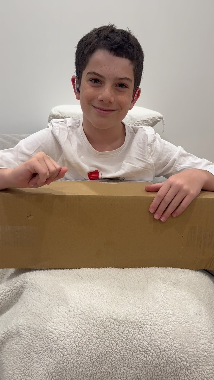 Eden opening a delivery box