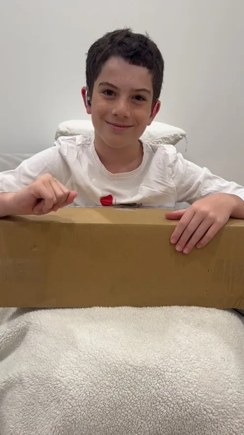 Eden opening a delivery box